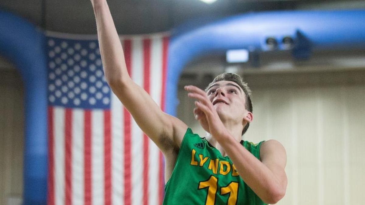 Lynden’s Clayton Whitman dunks after stealing the ball to give the Lions the lead late in the fourth quarter during a 47-44 victory over Anacortes at the Class 2A Hardwood Classic on Thursday, March 2, at the Yakima Valley SunDome in Yakima.