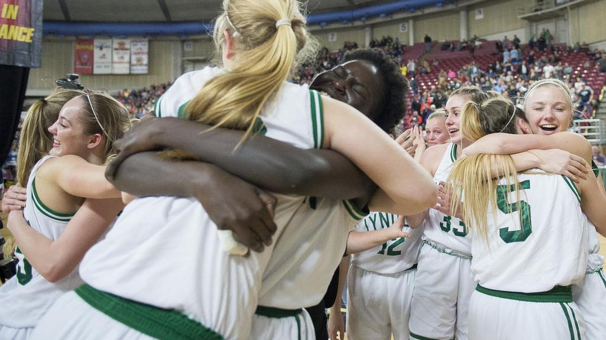 Lynden players celebrate their 44-36 victory over Burlington-Edison in the Class 2A girls state championship game on Saturday, March 4, at the Yakima Valley SunDome.
