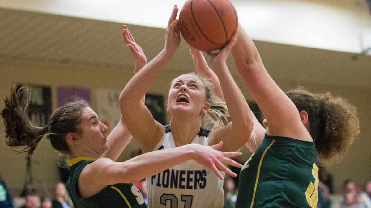Nooksack Valley’s Karley Stremler, center, is fouled by Sehome defenders on Tuesday, Jan. 9 at Nooksack Valley High School in Everson. Stremler made her subsequent foul shots as Nooksack Valley defeated Sehome, 56-32.