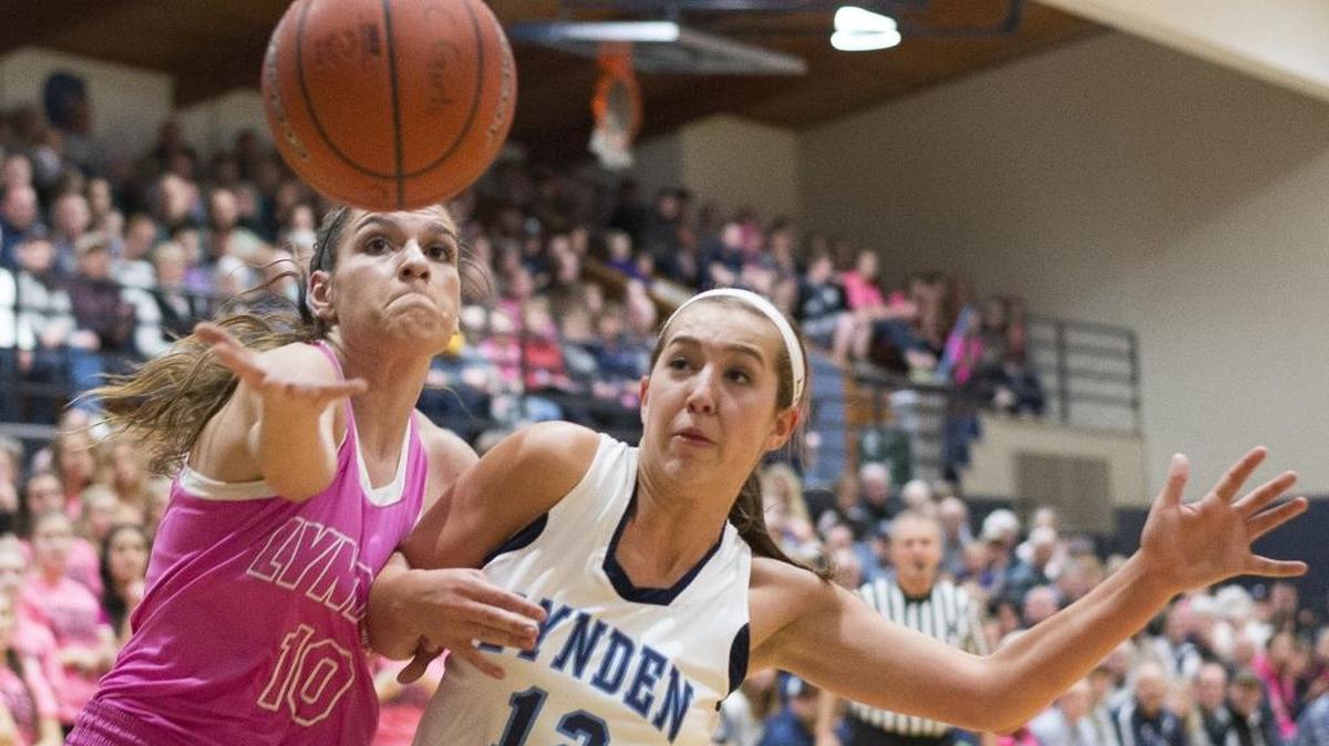 Lynden's Mariah Gonzalez, left, dives around Lynden Christian's Haley Hollander to keep the ball in play on Jan. 22. Both Lynden and Lynden Christian head to the regional round of their respective state tournaments.