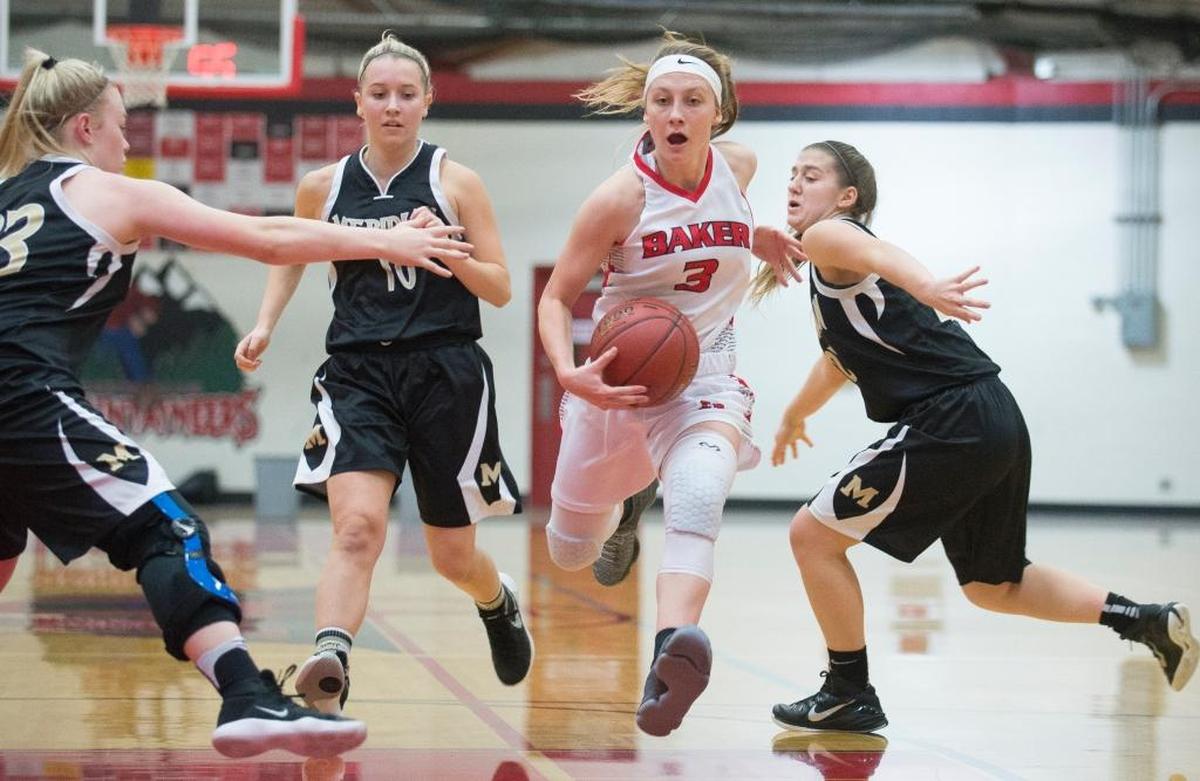 Mount Baker’s Danielle Tyler drives to the hoop through Meridian’s defense on Thursday, Nov. 30, at Mount Baker High School in Deming.