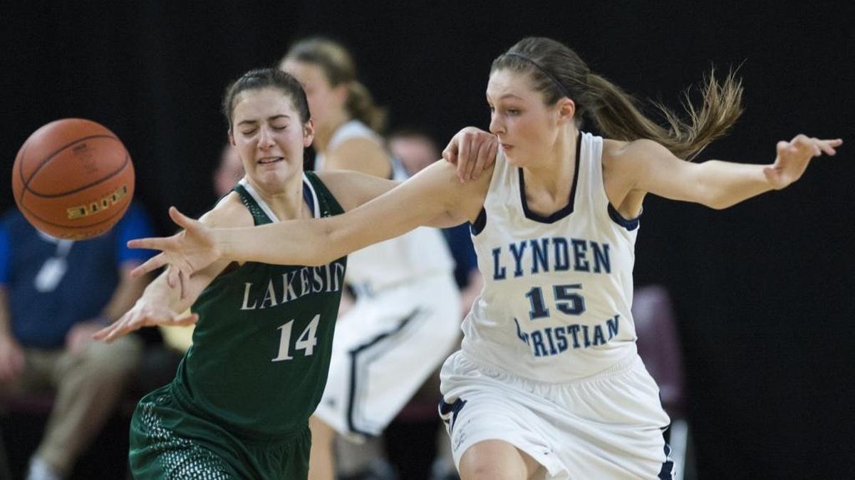 Lynden Christian’s Kara Bajema goes for a steal on Lakeside’s Kelsey Jones in a Class 1A State Tournament quarterfinal basketball game March 5 at the Yakima Valley SunDome.