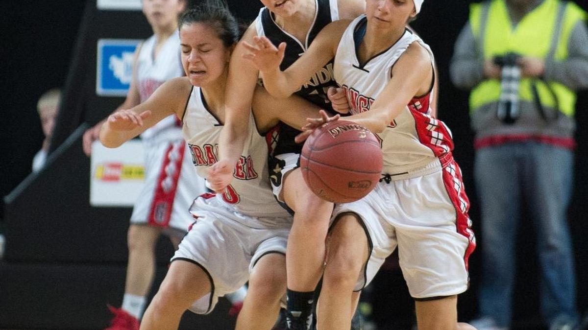 Meridian’s Taran Tutterrow, center, is sandwiched by Granger’s Naya Roettger, left, and Jayleen Vasquez as they chase after a loose ball at the Class 1A Hardwood Classic on Thursday, March 2, at the Yakima Valley SunDome in Yakima. Granger defeated defeated Meridian, 56-35.
