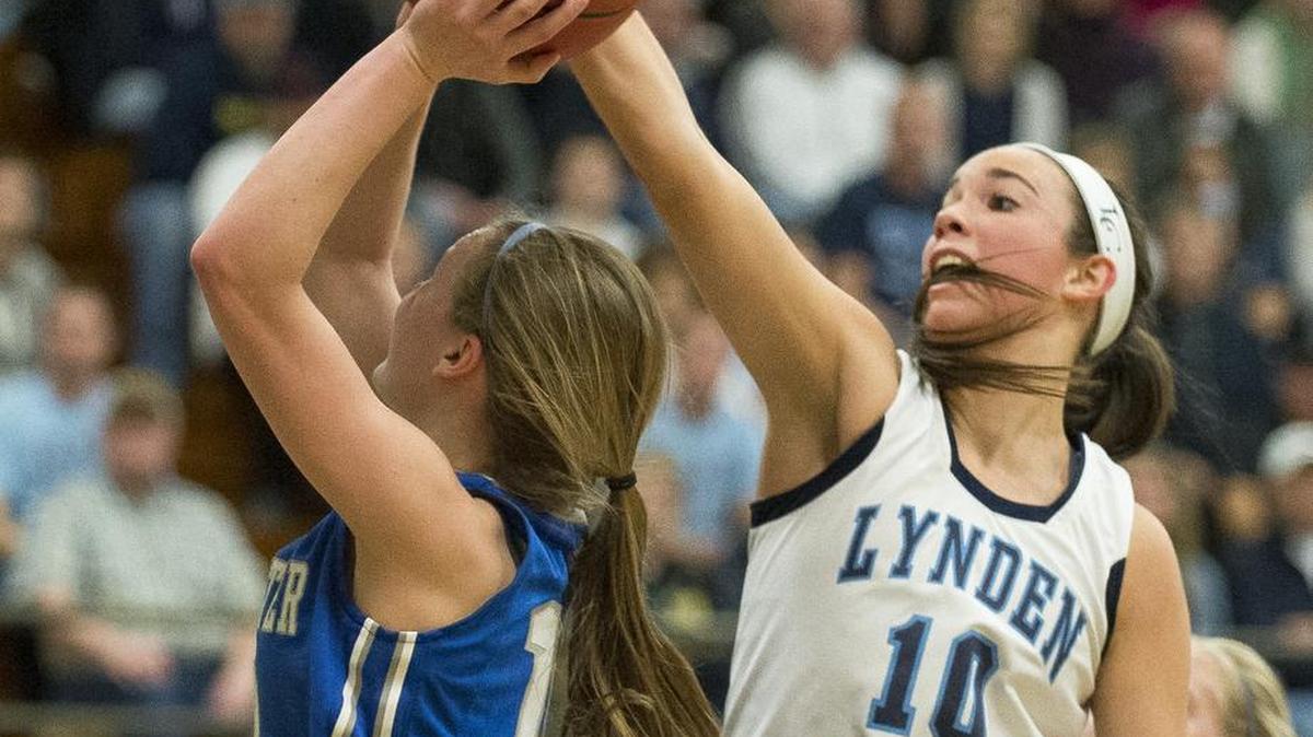 Lynden Christian's Isabela Hernandez, right, blocks a shot by La Center's Molly Edwards on Saturday, Feb. 25, at Mount Vernon High School. Lynden Christian defeated La Center 56-38.