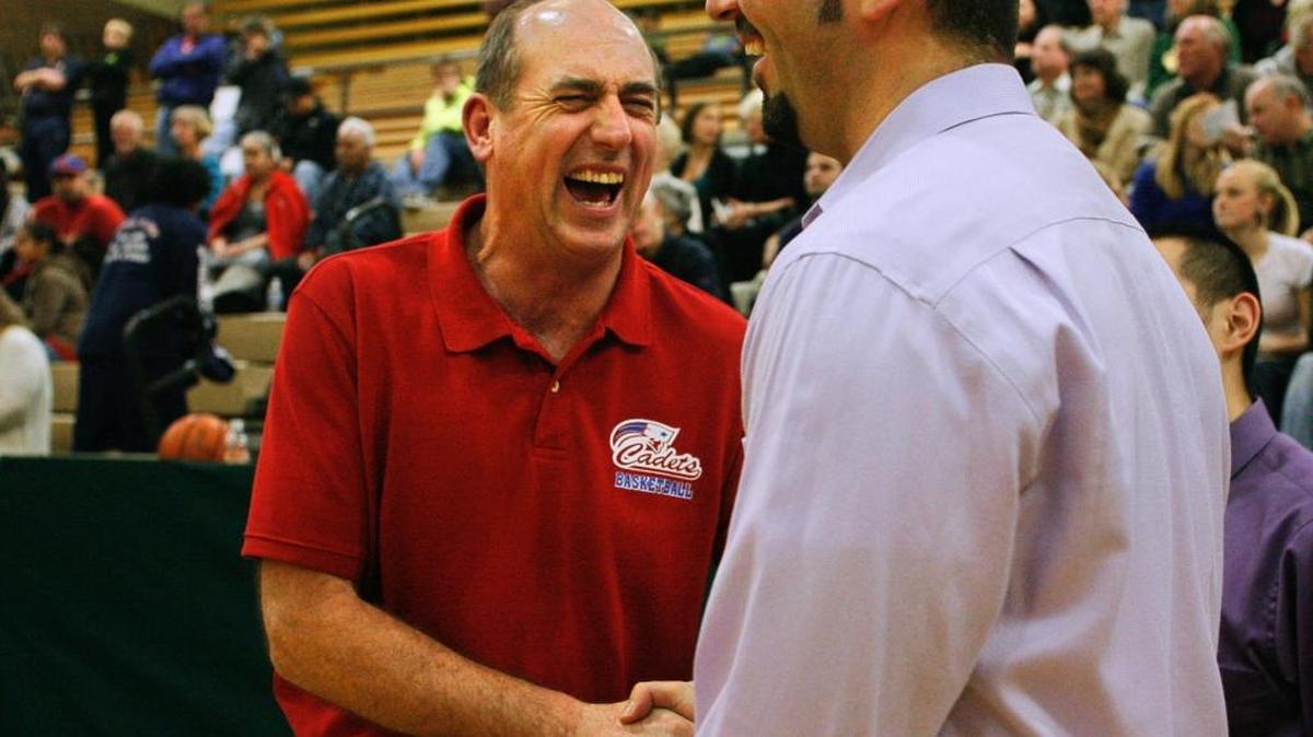 Former Sehome head coach Pat Fitterer greets former player, AJ LaBree, prior to the start of the Mariners’ game against the Eisenhower Cadets in Bellingham in December 2008.