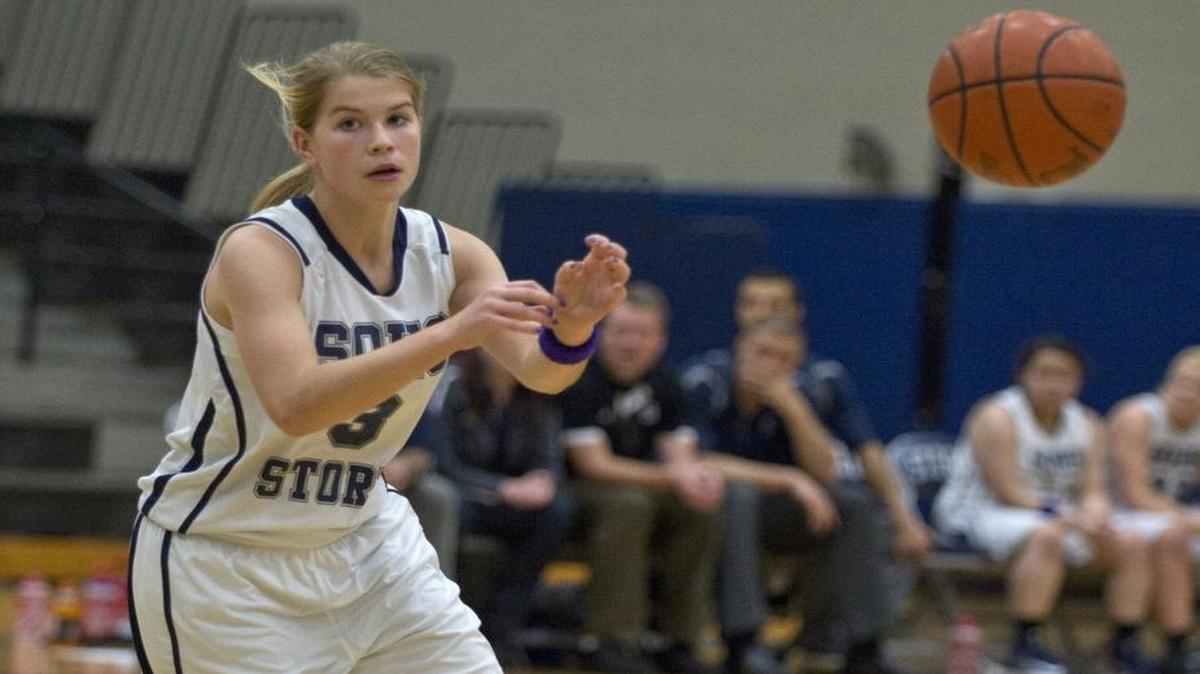 Squalicum’s Sarah Hulbert passes the ball to a teammate against Burlington-Edison on Jan. 20, 2014.