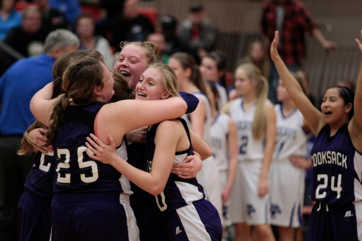 Nooksack Valley celebrates beating La Center 47-39 in a 1A regional state playoff game on Saturday, Feb. 27, at Battle Ground High School.
