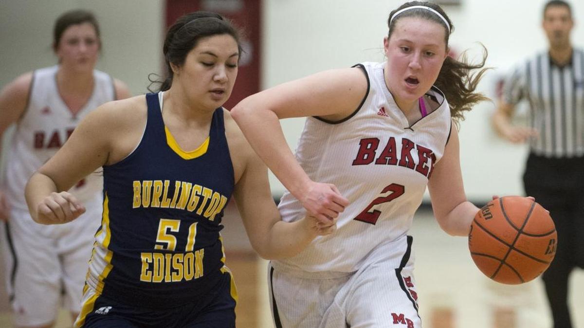 Mount Baker’s Emily Brandland drives toward the basket against Burlington-Edison’s Sam Alumbres Jan. 16, in Deming.