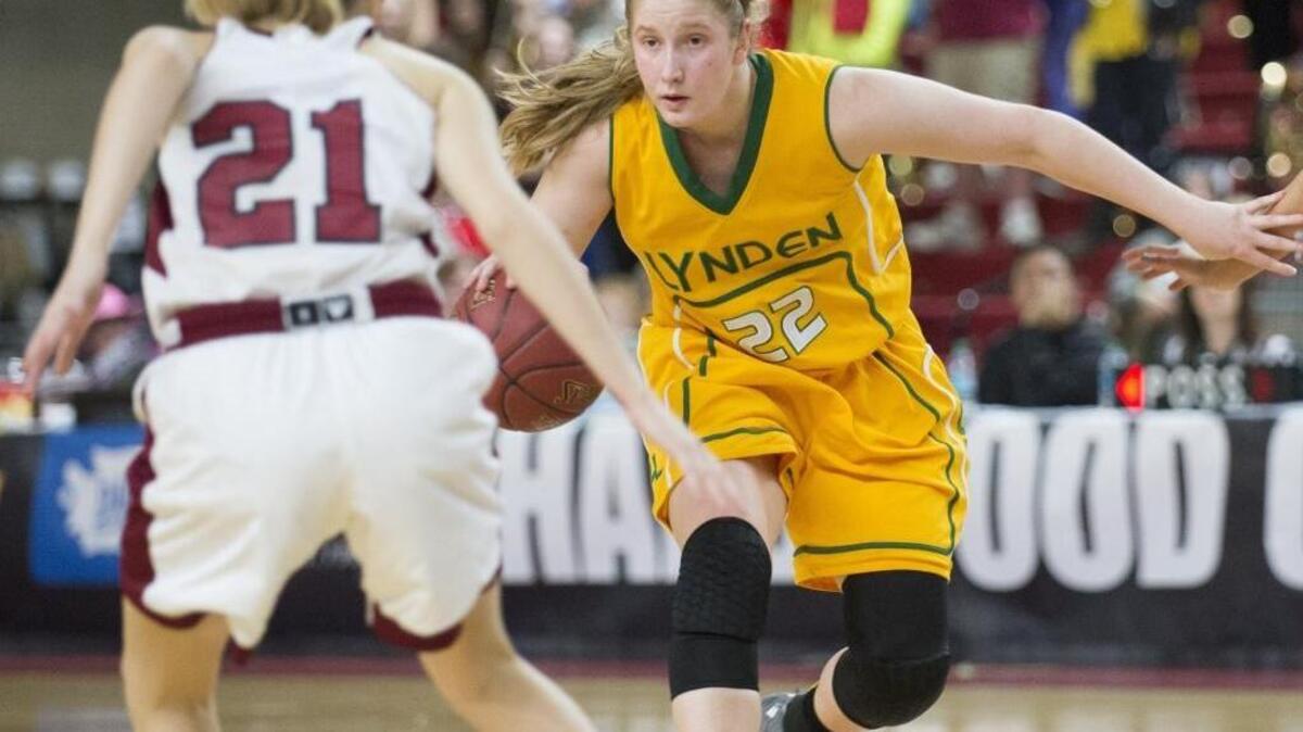 Lynden’s Elisa Kooiman looks for an opening against W.F. West in the Lions’ semifinal game of the Class 2A state basketball tournament Friday, March 3 in Yakima. Lynden won the game, 61-53, en route to the state title.