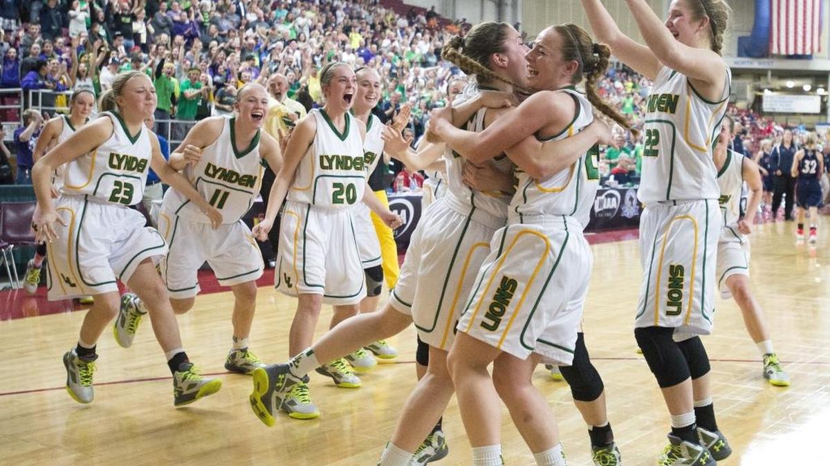 Lynden players celebrate defeating Ellensberg 37-34 in the 2A girls’ semifinal to advance to the state championship on Friday, March 4, at the Yakima Valley SunDome.