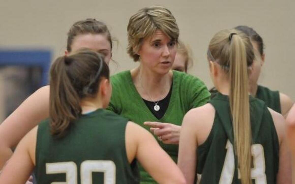 Sehome coach Kim Kirk talks to her team during a timeout during a 2013 game. Kirk has decided to step down after nine seasons leading the program.