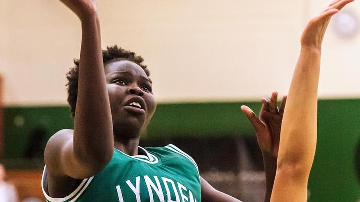 Lynden’s Faith Dut (11) shoots over Burlington-Edison’s Jazzlynn Woods (34) during the third quarter in the Class 2A Northwest District Championship semifinal on Monday at Mount Vernon High School. Burlington-Edison won 54-50.