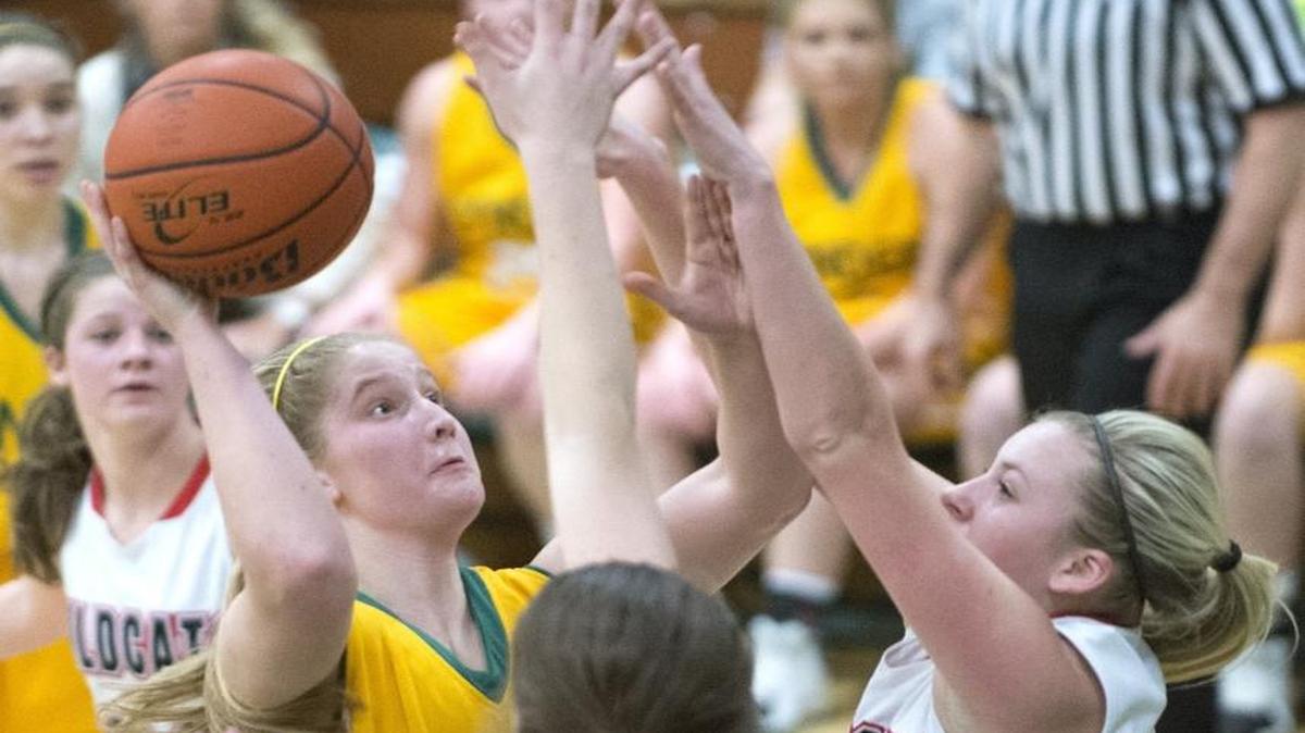 Lynden's Elisa Kooiman goes up for a layup over Archbishop Murphy defenders in the semifinals of the Class 2A Northwest District Tournament on Feb. 17.