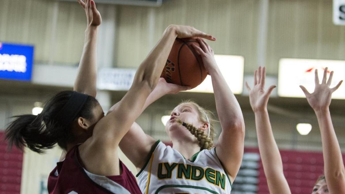 Lynden's Elisa Kooiman, center tries to put up a shot against Chehalis W.F. West in a Class 2A State Tournament quarterfinal basketball March 5 at the Yakima Valley SunDome. Kooiman leads the Northwest Conference with 19.9 points per game this season.