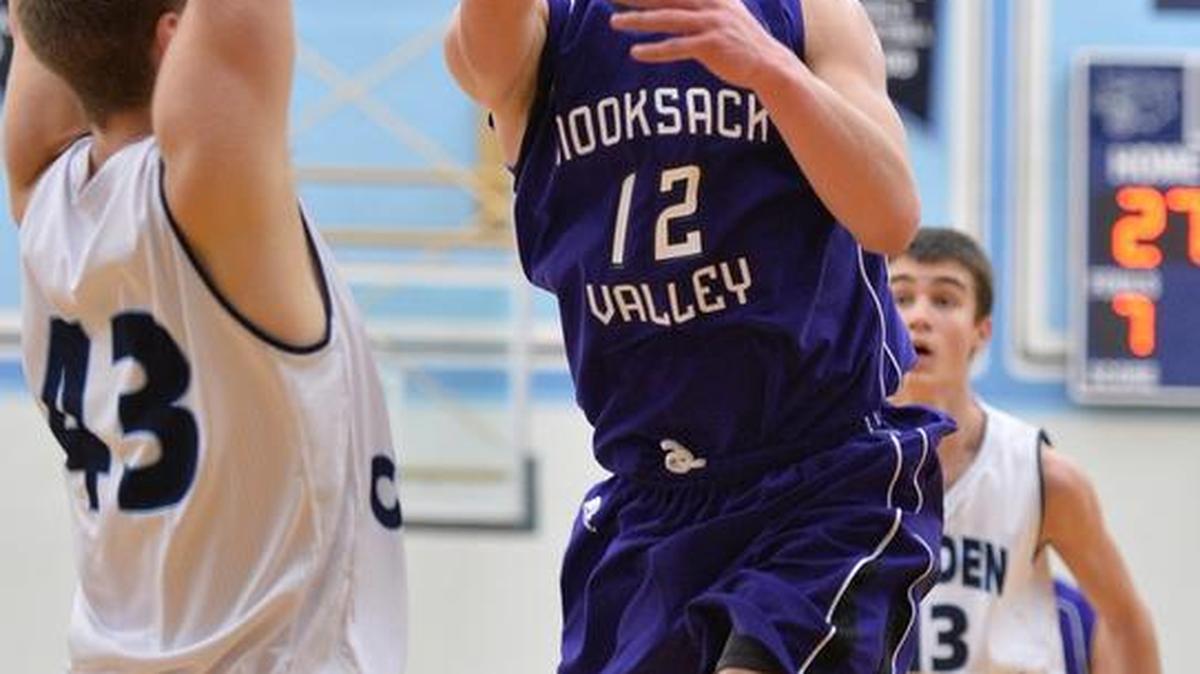 Nooksack Valley's Connor Beard misses an under hand shot at the basket as Lynden Christian beat Nooksack Valley 76-45 in a boys' basketball game on Saturday, Feb. 1, 2014, in Lynden.