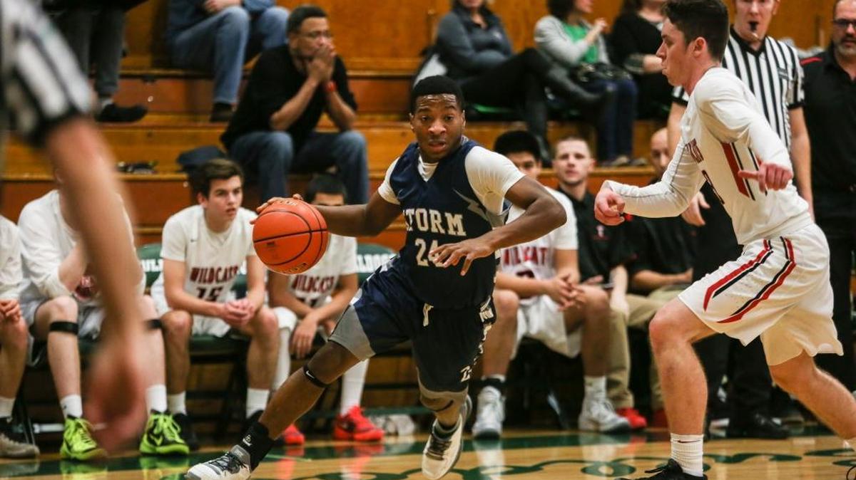 Squalicum’s Damek Mitchell drives to the basket past Archbishop Murphy’s Houston Schmutz during the first quarter of a Class 2A Northwest District semifinal Tuesday, Feb. 16, at Mount Vernon High School. Mitchell led Squalicum with 17 points in its 59-54 victory over Archbishop Murphy.
