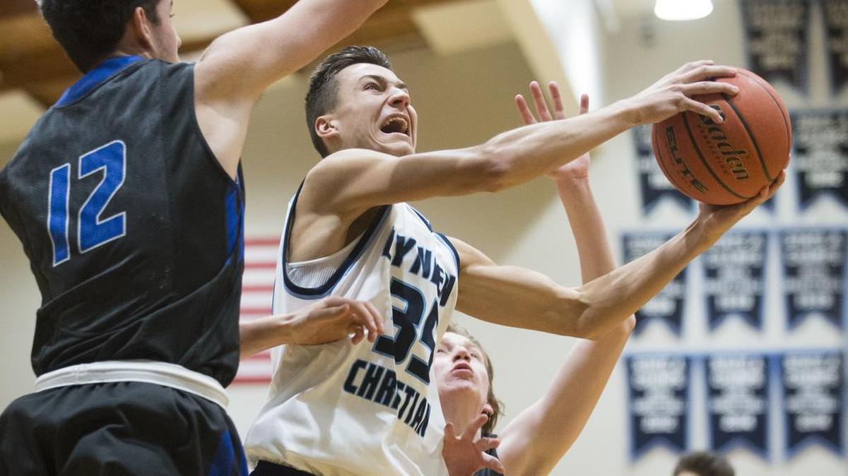 Lynden Christian's Grant Rubbert goes for a layup during a 62-49 victory over South Whidbey on Thursday, Feb. 9, at Lynden Christian High School.