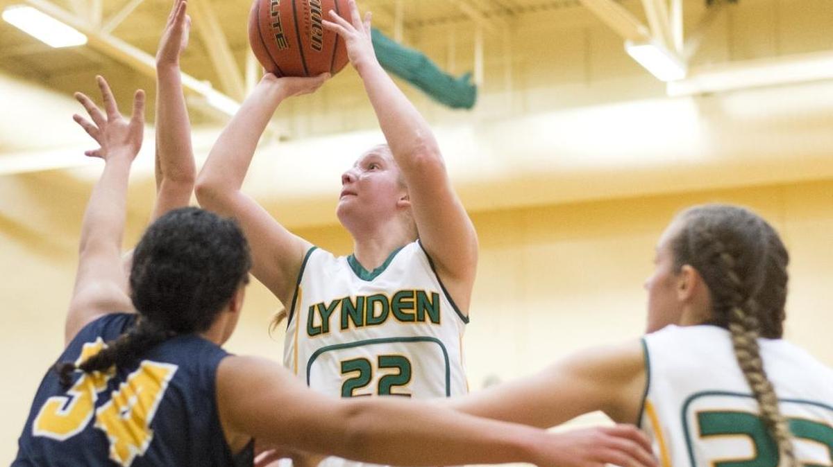 Lynden’s Elisa Kooiman shoots and scores over Burlington-Edison’s Jazzlynn Woods Jan. 26 at Lynden High School.