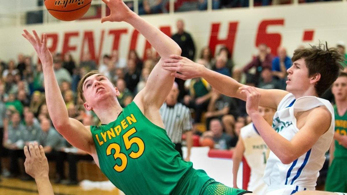 Lynden’s Davis Bode rebounds the ball while falling backward on Saturday, Feb. 27, at Renton High School.
