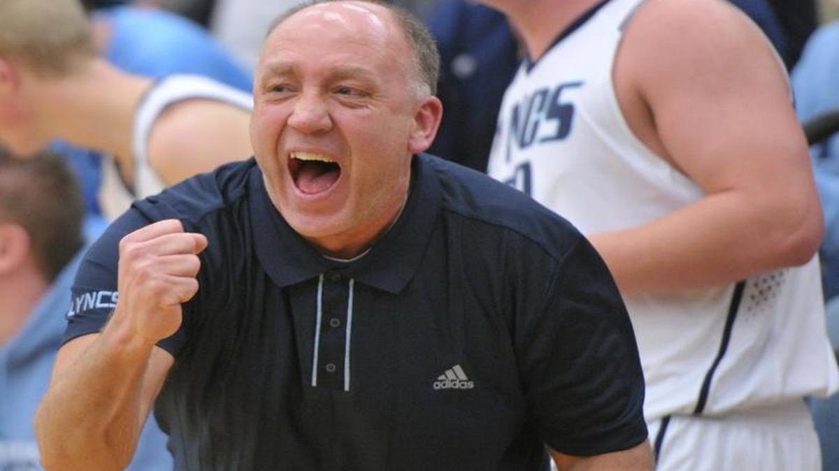 Lynden Christian coach Roger DeBoer cheers and pumps a fist after the Lyncs score a 3-point shot against Meridian in 2012. DeBoer will enter the WIBCA Hall of Fame along with Squalicum’s Dave Dickson and Lynden’s Brian Roper on Thursday, July 28.