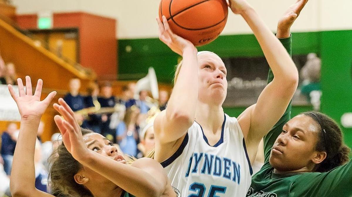 Lynden Christian’s Sam Van Loo (25) shoots between Charles Wright Academy’s Naomi Pikes (25), left, and Shoni Pritchett (52), on Friday, Feb. 26, at Mount Vernon High School.