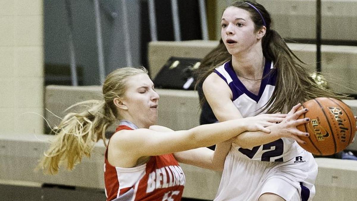 Nooksack Valley’s Mariah Perry looks for an open team mate as Bellingham’s Emily Benson on Dec. 8, 2014.