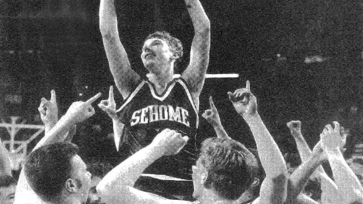 Sehome raises Jeff Chapman and the state championship trophy after beating Decatur in the Class AAA State Championship Game March 9, 1996, at Key Arena. Chapman set a tournament record with his 3-point shooting accuracy.