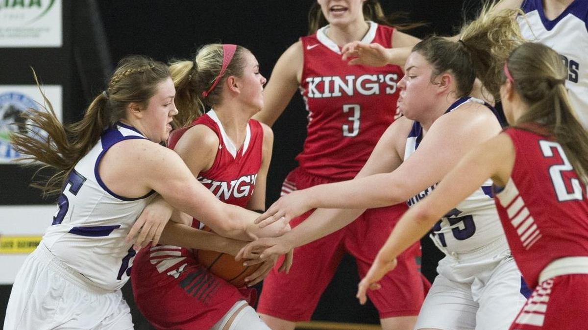 Nooksack Valley’s Rachel Sande, left, and Emilia Gimmaka fight for a rebound during a loss to King’s in a 2016 girls Class 1A state semifinal at the Yakima Valley SunDome. Sande on Friday signed her letter of intent to play for Whatcom Community College.