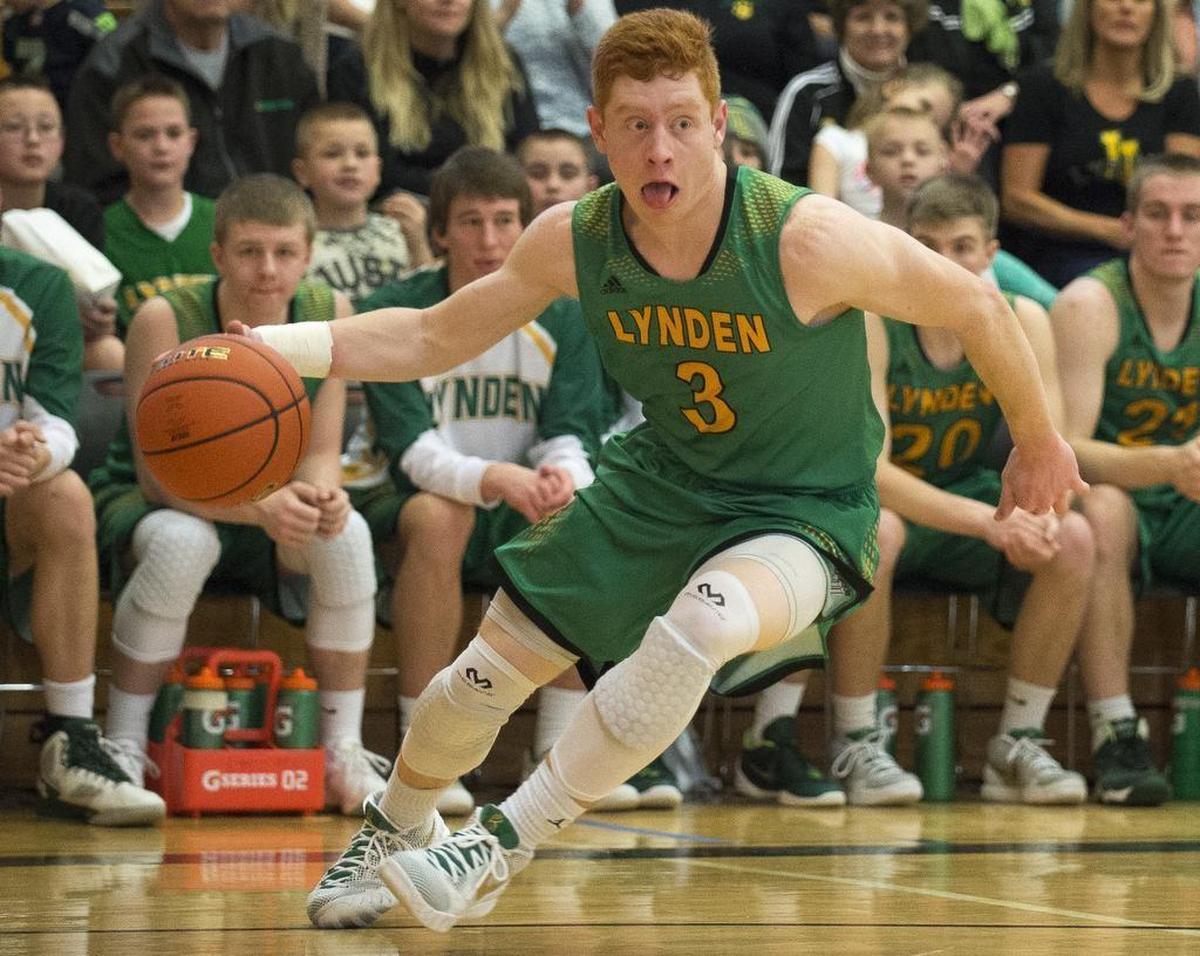 Lynden’s Noah King tries to drive inside during the Lions 57-51 2A regional round victory over Liberty 57-51 Saturday, Feb. 27, at Renton High School.