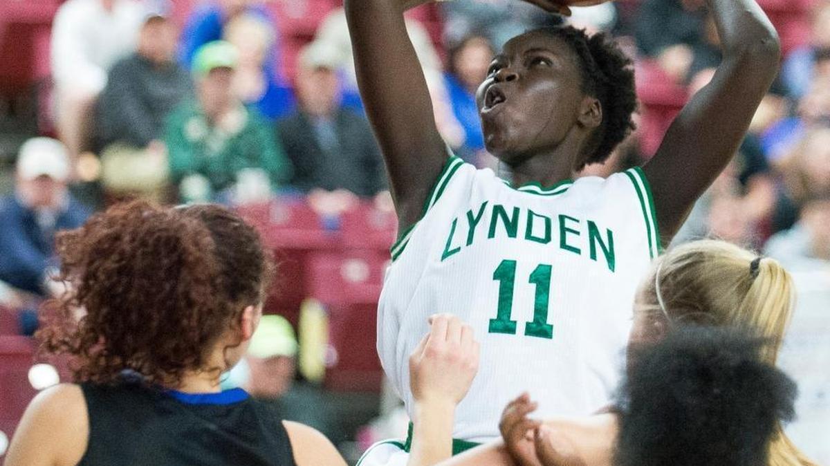 Lynden's Faith Dut shoots and scores after grabbing an offensive rebound during a 56-29 victory over Olympic on opening day of the Class 2A Hardwood Classic on Wednesday, March 1, at the Yakima Valley SunDome in Yakima.