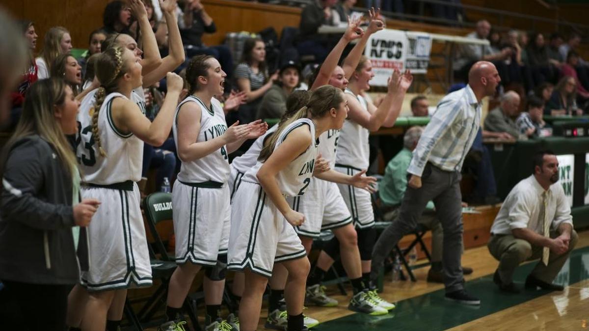 The Lynden bench celebrates after Lauren Zwiers made a three-point shot on Feb. 15 in a Class 2A Northwest District Tournament semifinal win over Shorecrest at Mount Vernon High School.