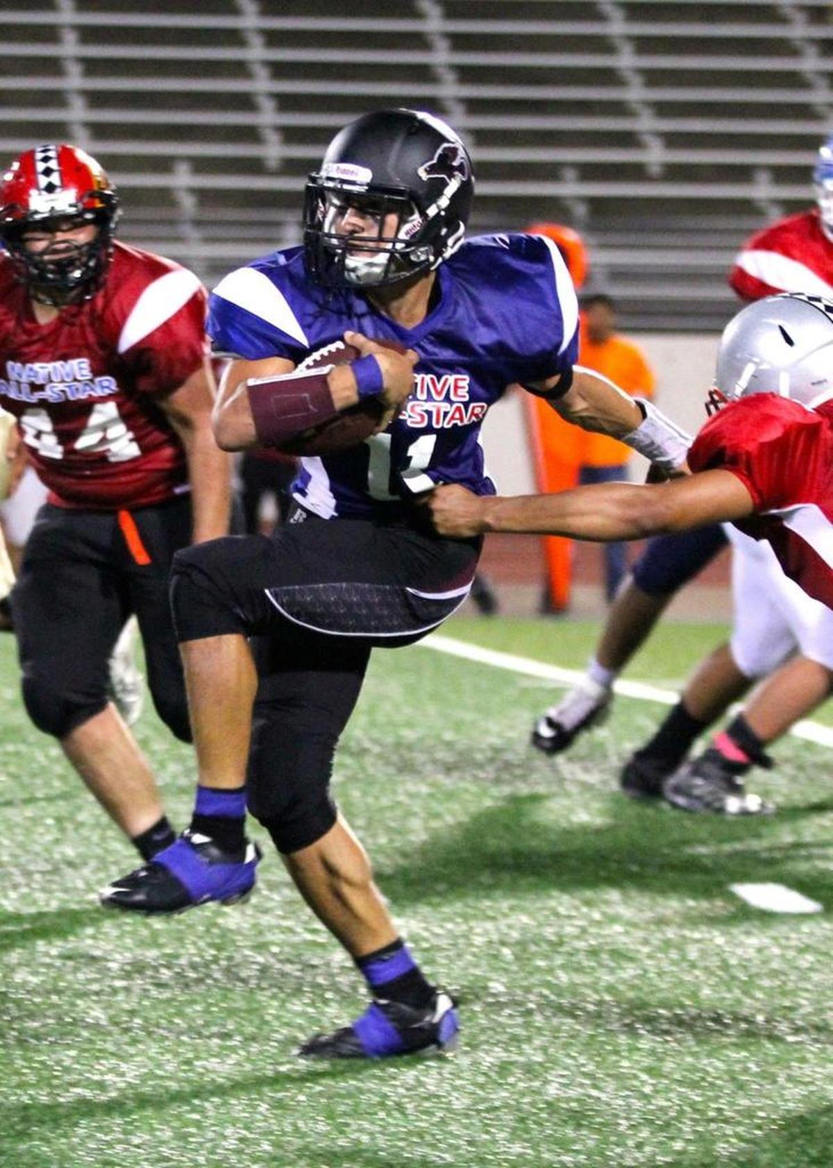 Lummi’s Free Borsey picks up yardage during the 2017 Native All-Star Football Classic Saturday in Arlington, Texas.