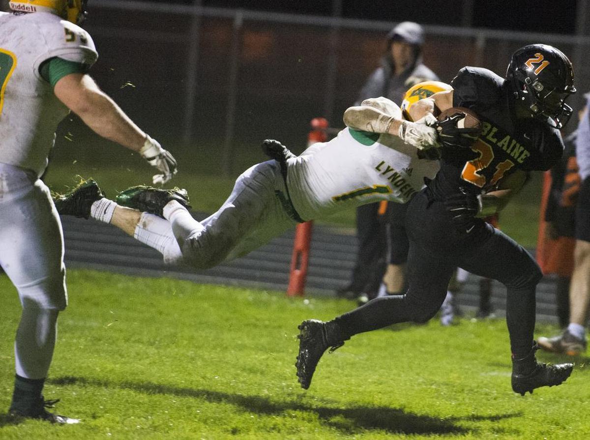 Blaine's Riley Fritsch runs through an attempted tackle by Lynden's Jordan Wittenberg to score a touchdown on Friday, Oct. 30, at Blaine High School.