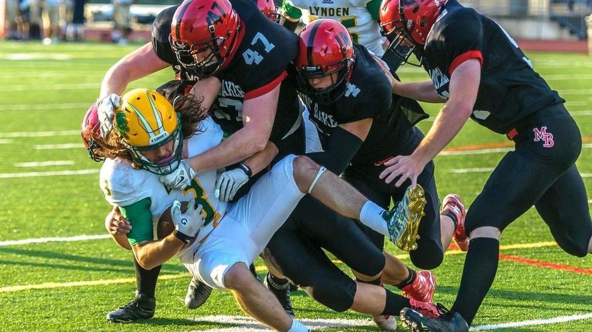 Lynden’s Eric Martin-Mann is gang tackled by Mount Baker’s TJ Bass (47) and Jed Schleimer (4) during a jamboree Aug. 27 at Civic Stadium. Bass and Schleimer were selected co-players of the year for the All-1A Northwest Conference team.