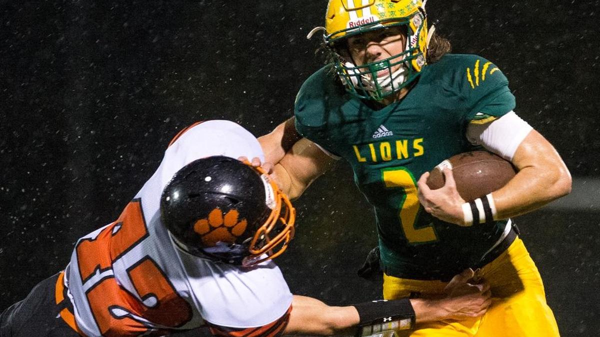 Lynden's Jacob Hommes, right, stiff-arms Granite Falls' Andy Klinnert on Saturday, Nov. 5, at Civic Stadium.
