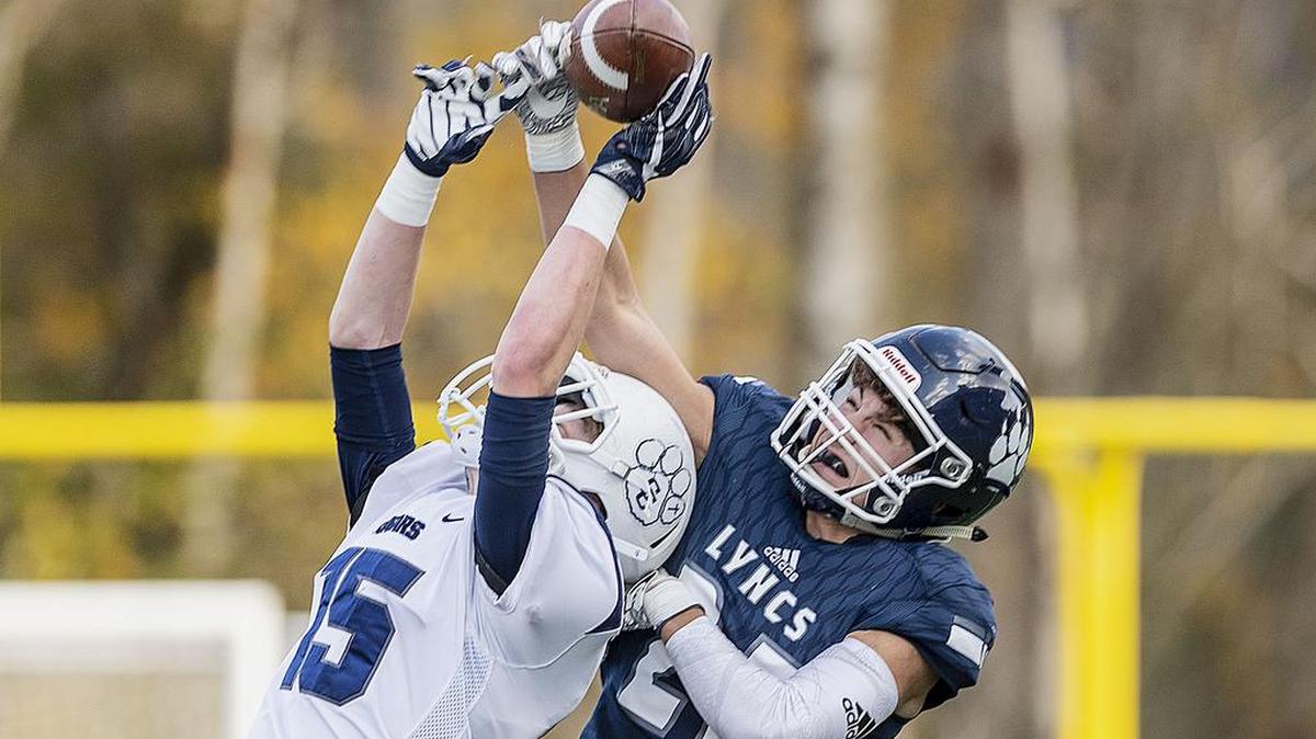 Lynden Christian defensive back Jude Veltkamp (25) breaks up a pass intended for Cascade Christian wide receiver Conner Zetterberg (15) during the third quarter in 1A state playoff opener on Nov. 10 at Civic Stadium in Bellingham. Lynden Christian defeated Cascade Christian 20-0 to advance.