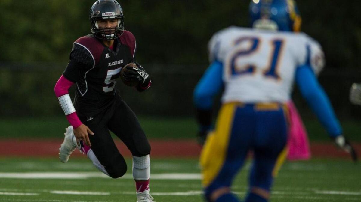 Lummi Nation's Trazil Lane runs downfield during a game against the Crescent Loggers on Oct. 9.