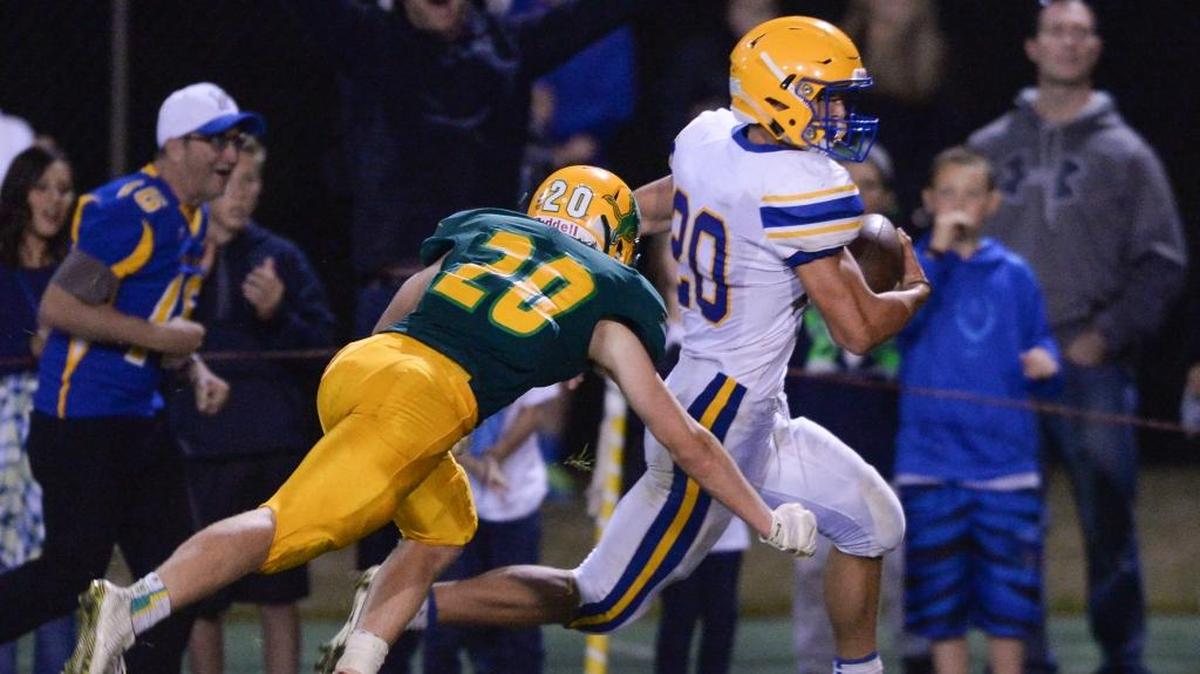Ferndale’s Ben Broselle scores a touchdown on a 22-yard run against Lynden’s Connor Shine during the fourth quarter on Friday, Sept. 9. The touchdown was the difference in the Golden Eagles’ 27-20 victory.