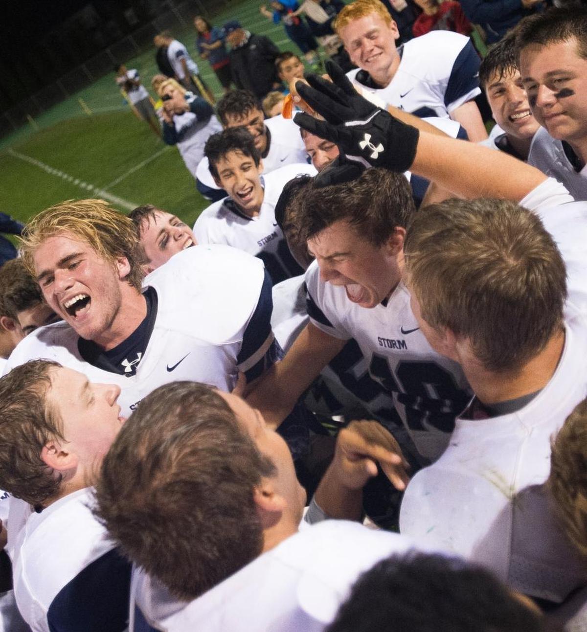 Squalicum celebrates defeating Lynden 27-0 on Friday, Sept. 18, at Lynden High School.