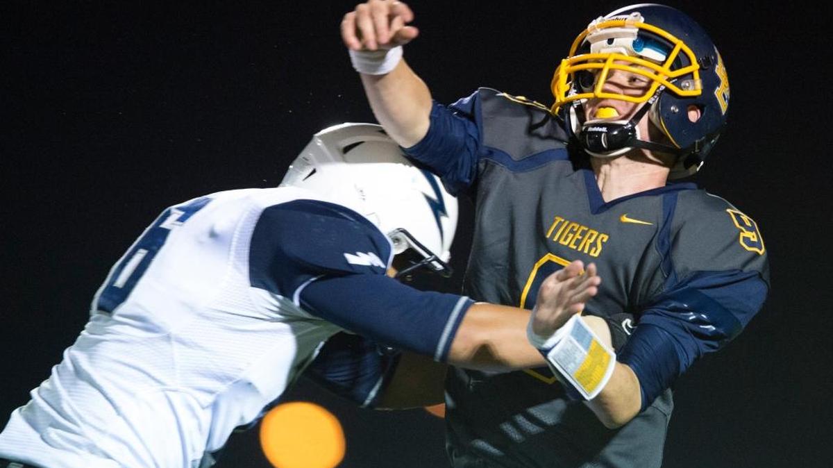
Squalicum’s Riley Zehnder hits Burlington-Edison QB Hunter Anderson after a pass during a NWC game Friday, Oct. 2, in Burlington.
