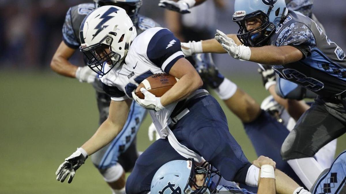 Squalicum’s Triston Smith fights for extra yardage against Gig Harbor on Sept. 2.