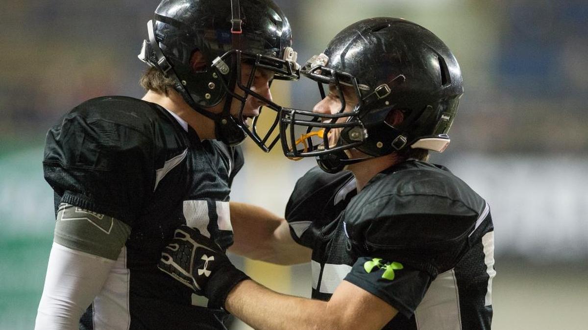 Meridian’s Simon Burkett, left, and teammate Baker Otter celebrate a Burkett touchdown run against Royal in the 1A state championship game Saturday, Nov. 2, at the Tacoma Dome.