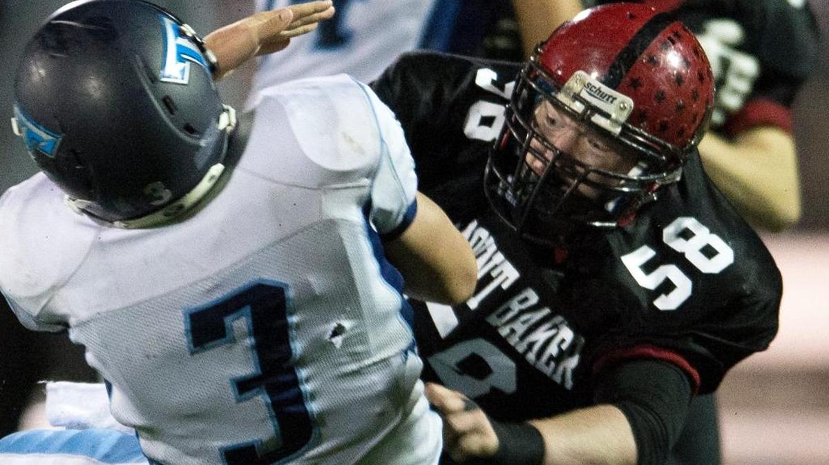 Mount Baker's Kolton Zender crushes Sultan's Tanner Belcher for a sack on Friday, Nov. 6, at Civic Stadium in Bellingham.