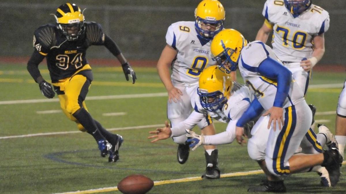 Ferndale’s Cooper Clark dives on a fumble during a 28-0 loss to Bellevue in the first round of the 2012 Class 3A state football playoffs. The WIAA Executive Board voted Monday to vacate Bellevue’s postseason results from 2012-14, , citing a “lack of institutional control” during those years.