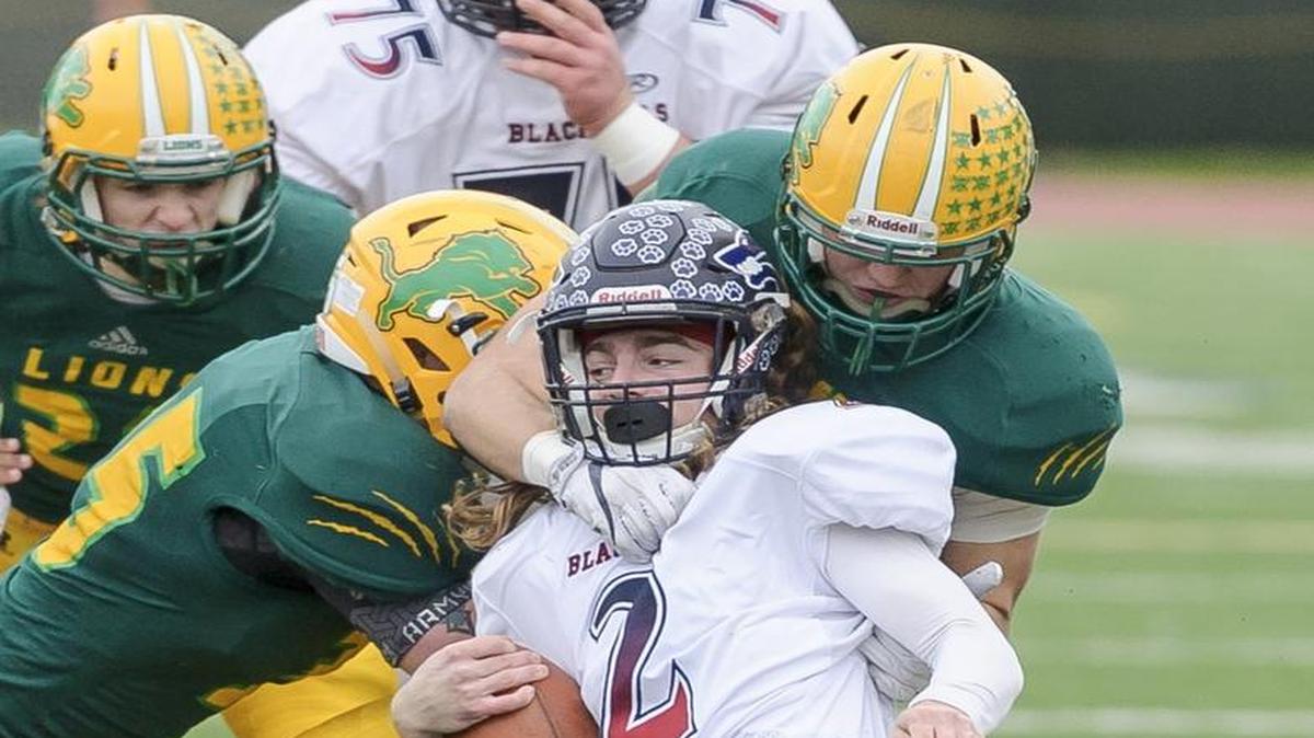 The Lynden defense stops Black Hills’ Kyler Nygren (2) at the line of scrimmage during the third quarter of the 2A state first round playoff varsity football game on Saturday afternoon, Nov. 12, 2016, at Civic Stadium in Bellingham, Wash.