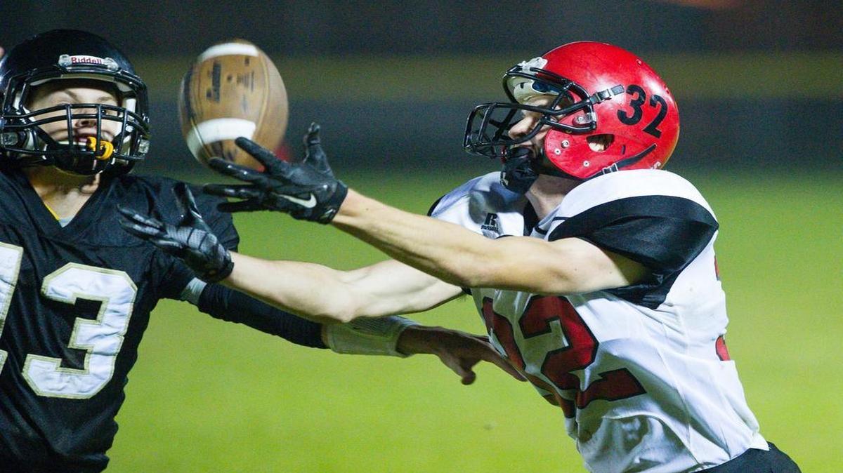 Mount Baker’s Thomas Barbo brings in a reception over the head of Meridian’s Simon Burkett in October 2015. The Mountaineers and Trojans face each for the first time this year Friday, Oct. 7, at Deming.