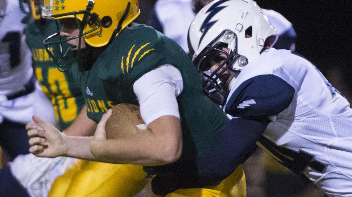 
Squalicum's Jack Wendling tackles Lynden's Sterling Somers on Friday, Sept. 18, at Lynden High School in Lynden, Wash.
