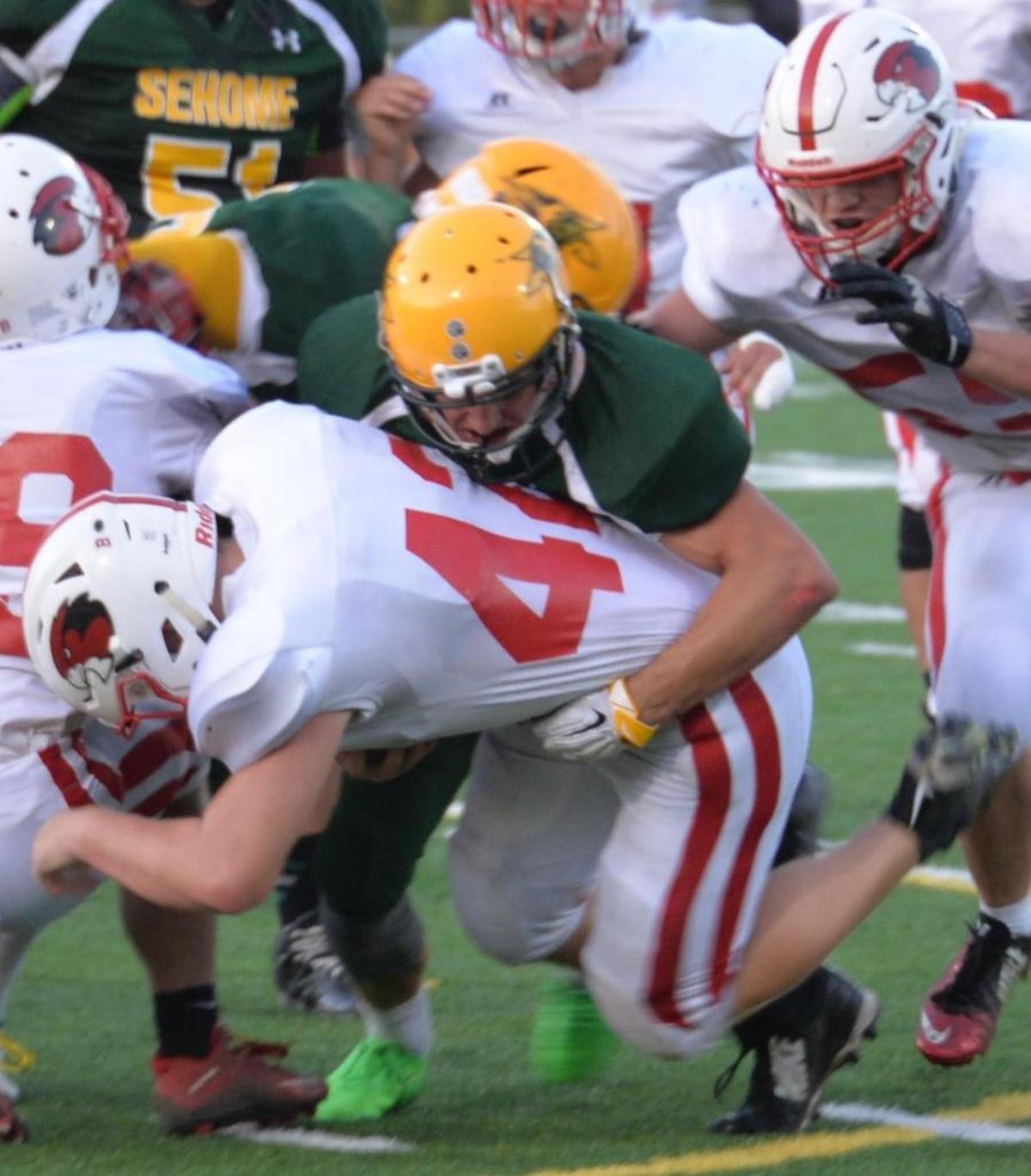 Bellingham running back Dakota Johnson fights for yardage against Sehome.