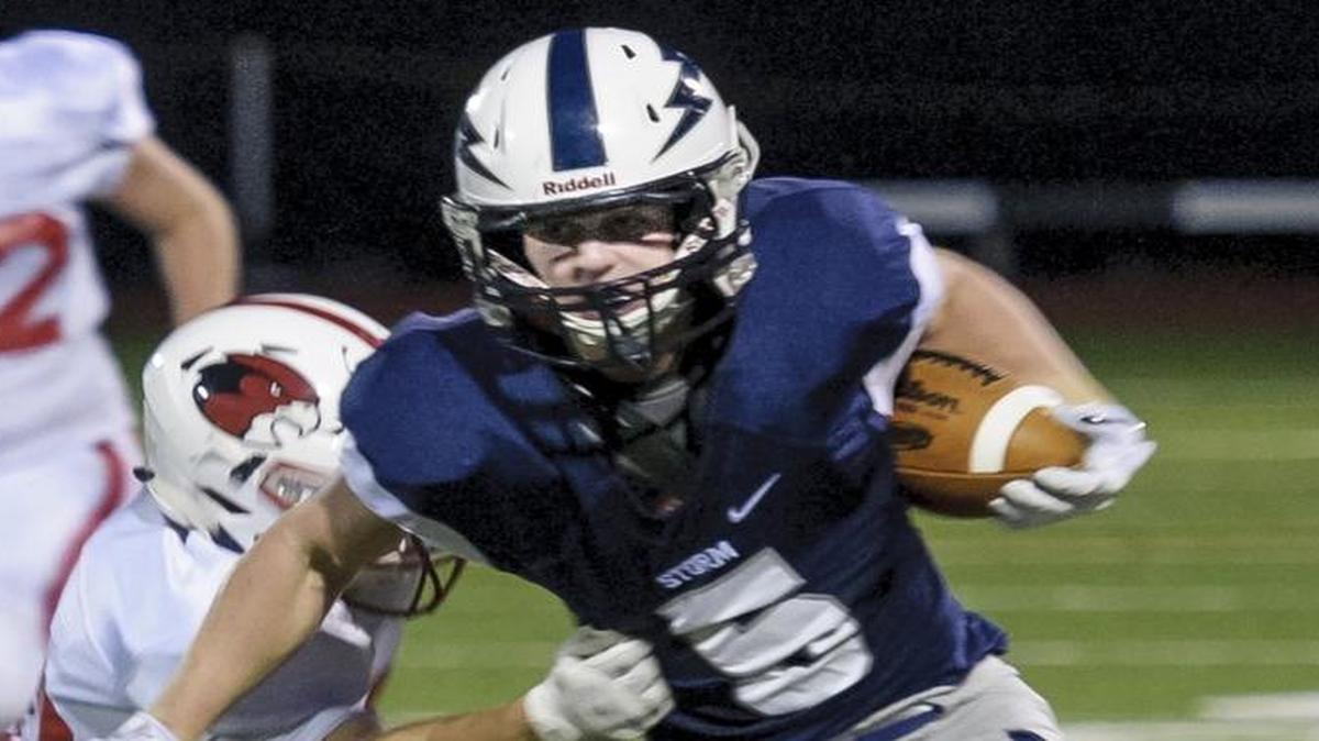 Squalicum wider receiver Ben Peterson breaks upfield for more yardage against Bellingham on Sept. 4. Peterson has received an offer to play football for the U.S. Naval Academy.