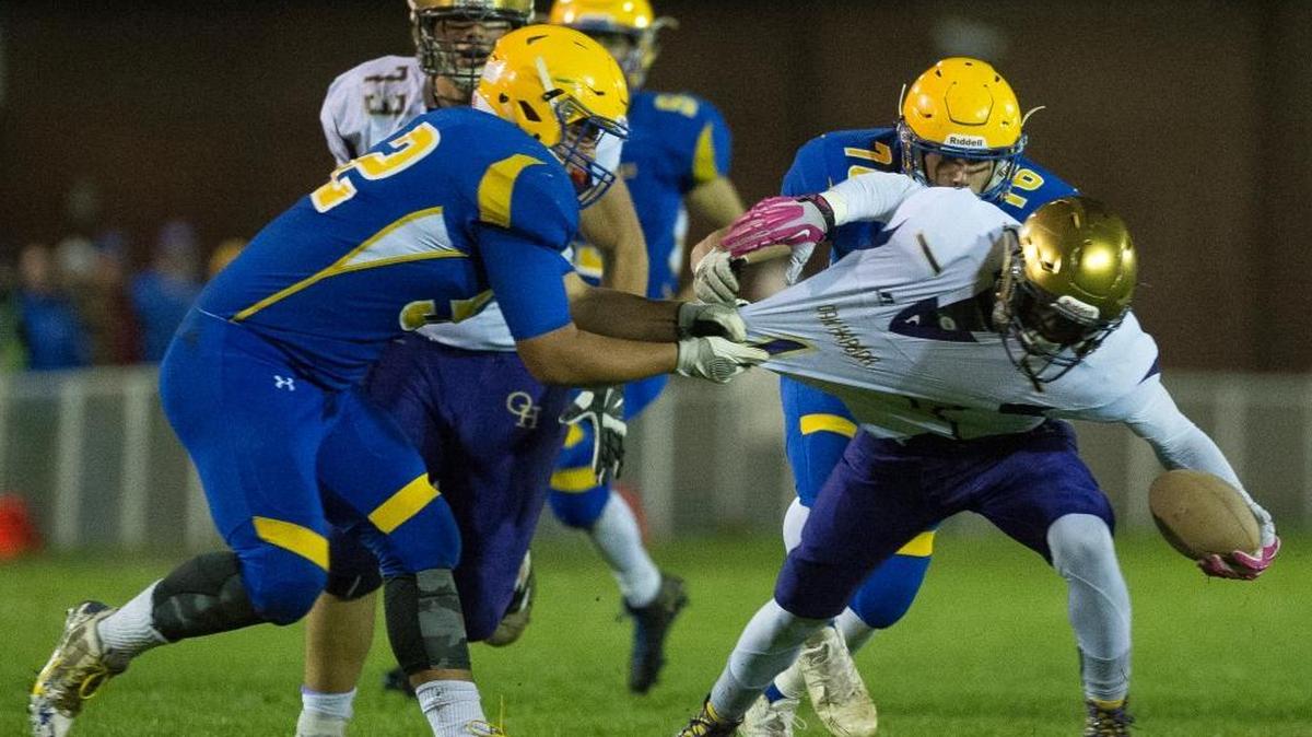 Ferndale’s Winterhawk Leighton drags down Oak Harbor’s Taeson Hardin for a loss Friday, Oct. 14, at Ferndale High School.